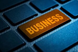 Golden 'BUSINESS' key on a keyboard, highlighting a focus on business tasks